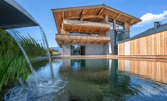 Sonnige Gartenwohnung mit privatem Schwimmteich