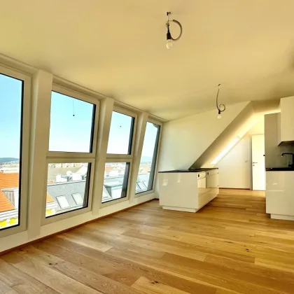 Grandioser Rundumblick: Neue 3,5 Zimmer DG-Wohnung mit großzügiger Terrassenfläche - Bild 2