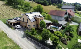 Tolles Einfamilienhaus mit integrierter Garage und südseitigem Flachdachturm in ruhiger Grünlage.