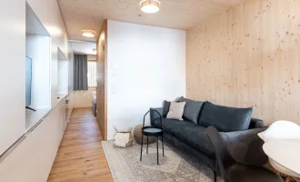 Erstklassiges Wohnen auf 33 m²: Moderne 2-Zimmer Vollholz Wohnung mit Balkon, Stellplatz und Fußbodenheizung in Au!